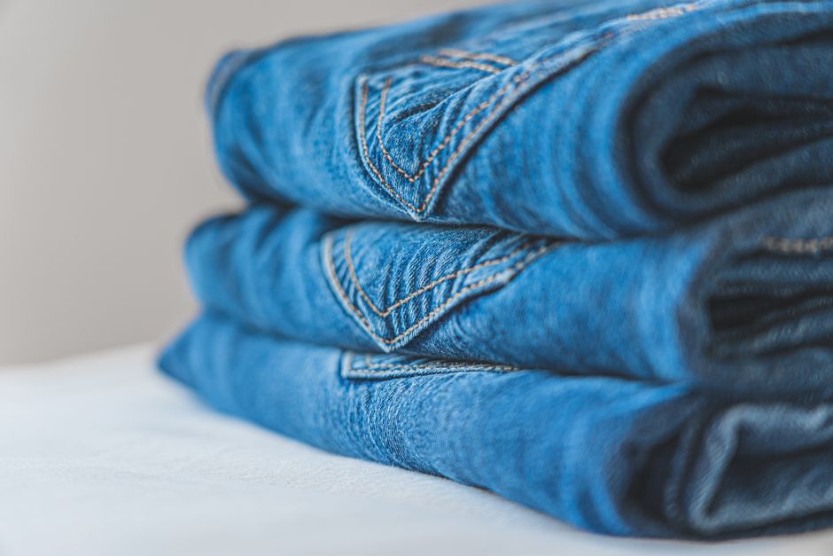 Neatly folded clothes in a custom walk-in closet