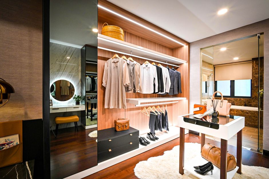 Modern walk-in closet with custom shelving and elegant lighting